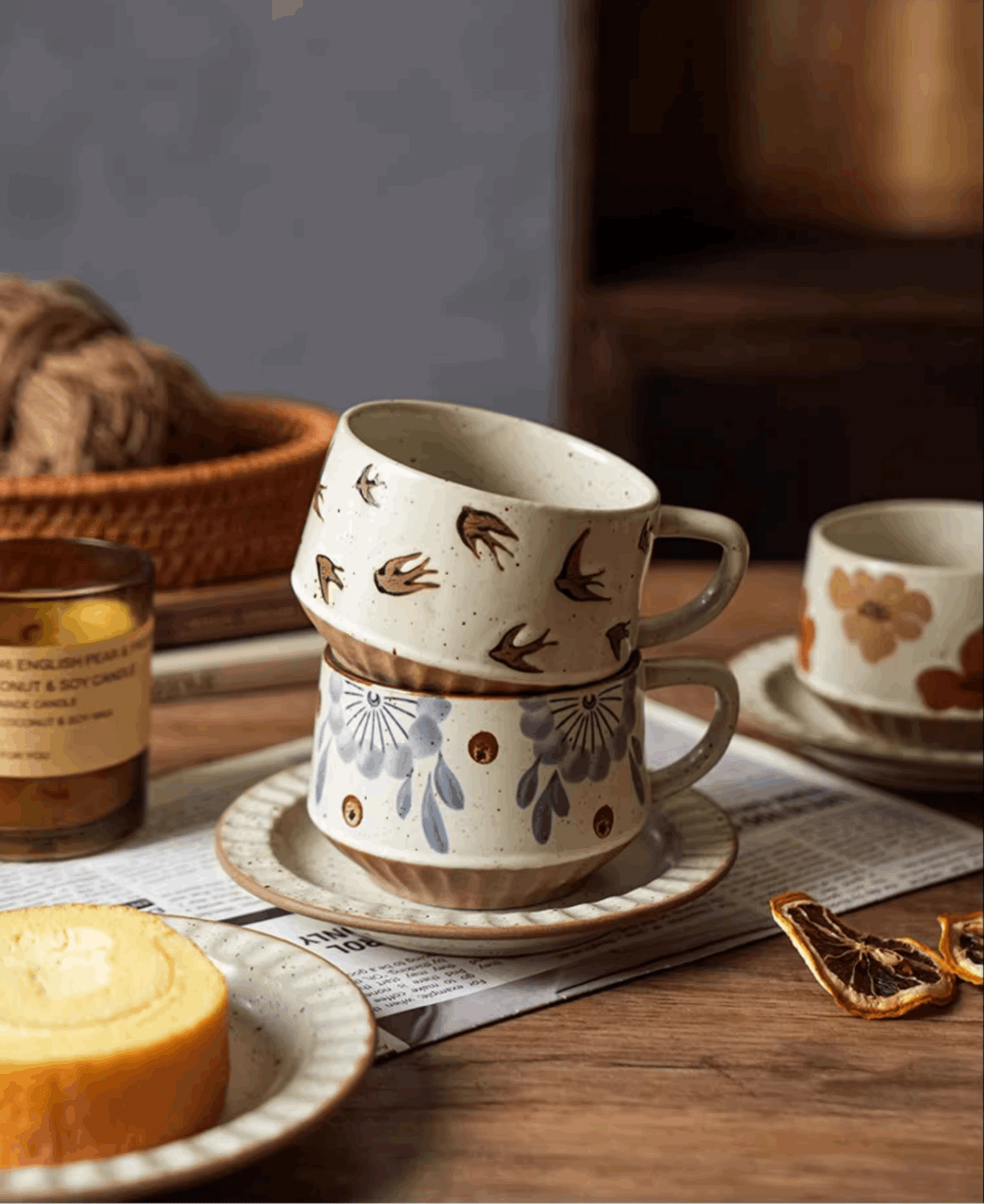 brown design cup on top of blue white floral cup mocha set