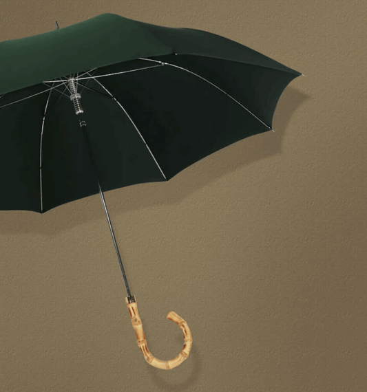 green umbrella open up with wood handle