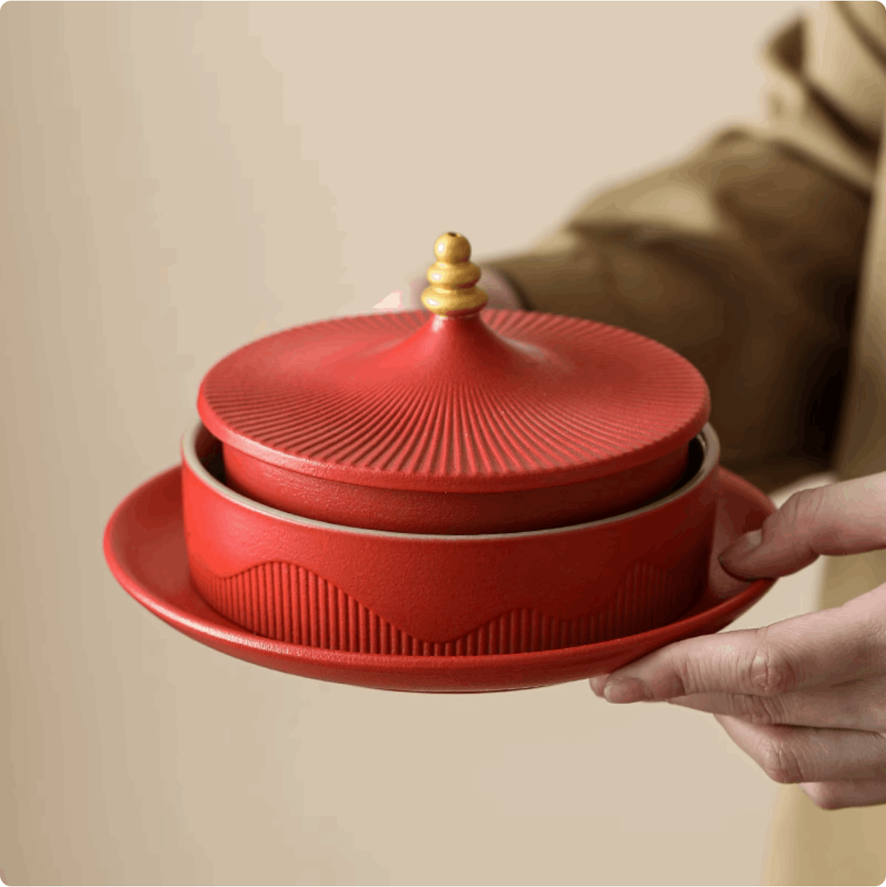 holding red serving platter