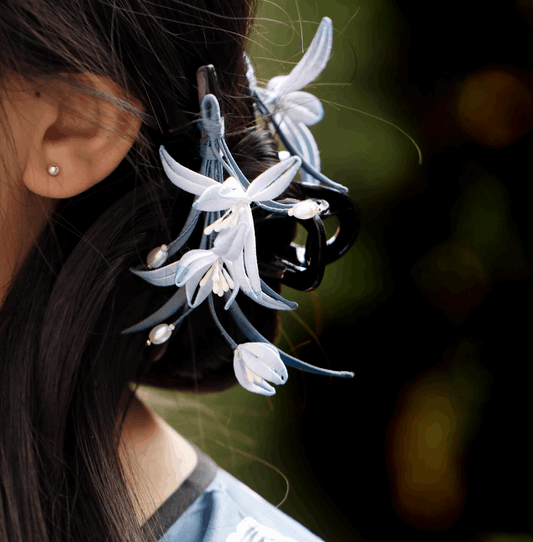 pearl with light blue flower claw clip on hair side view