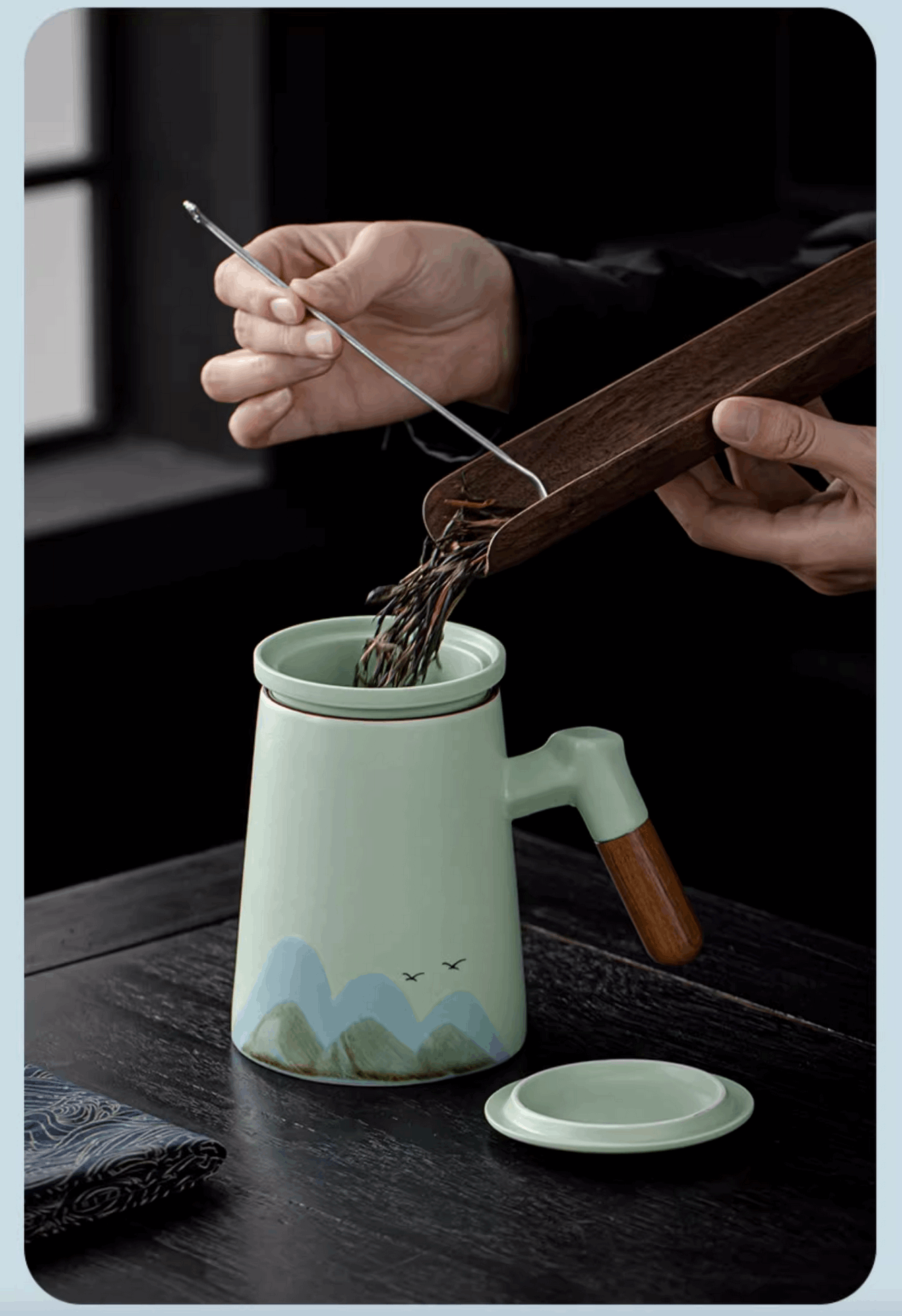 putting tea leaf into teapot