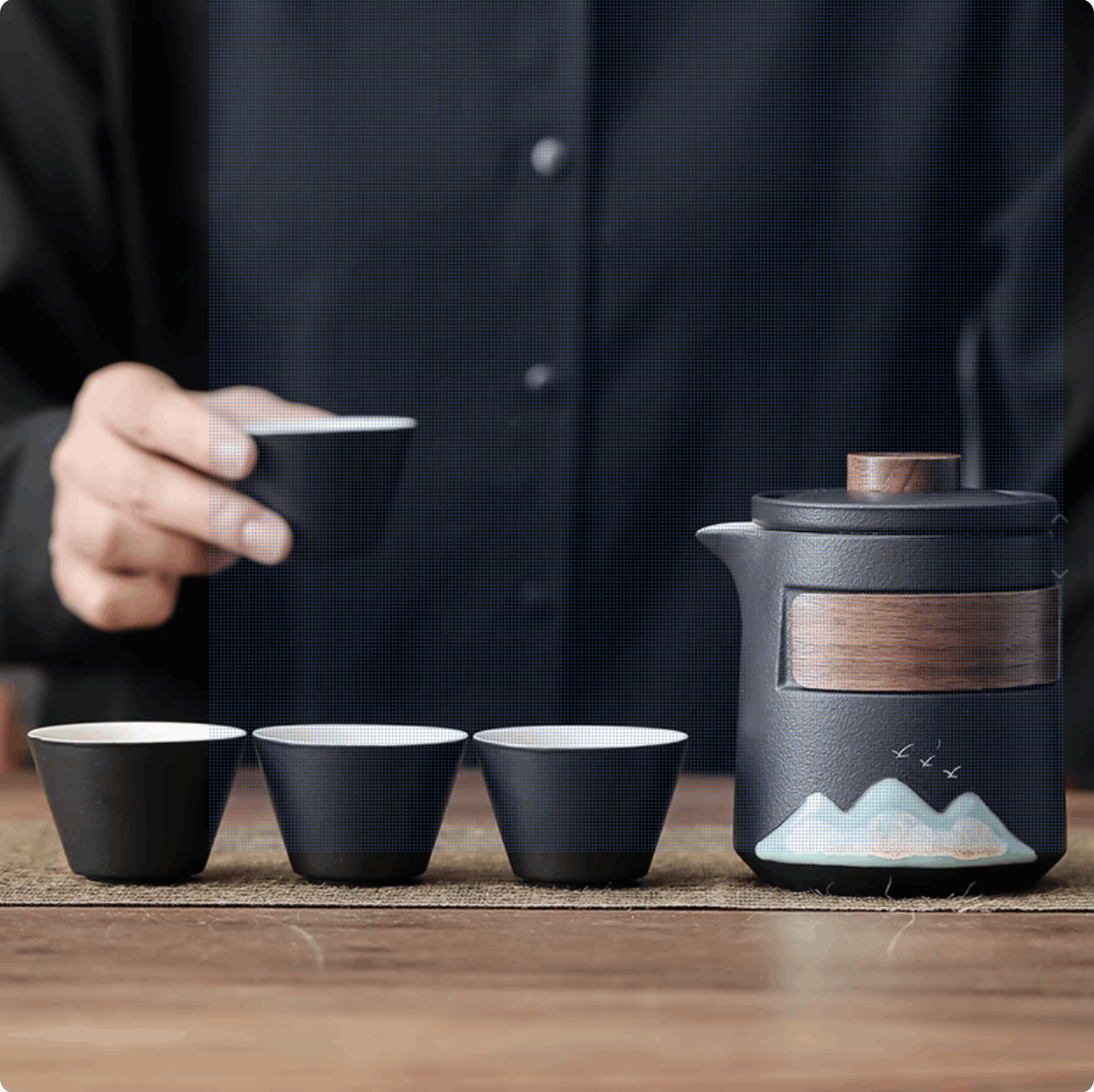black tea cup and black teapot