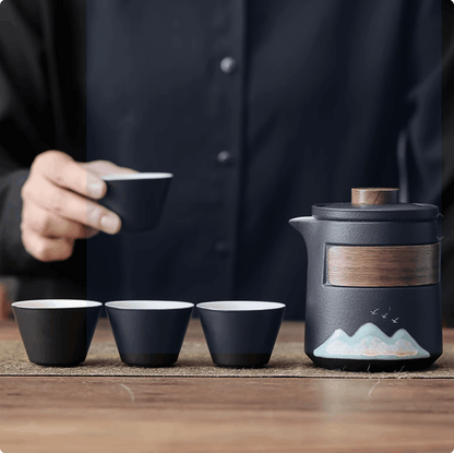 black tea cup and black teapot