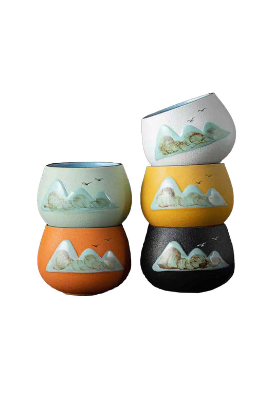 green orange white yellow black mountain valley teacup set