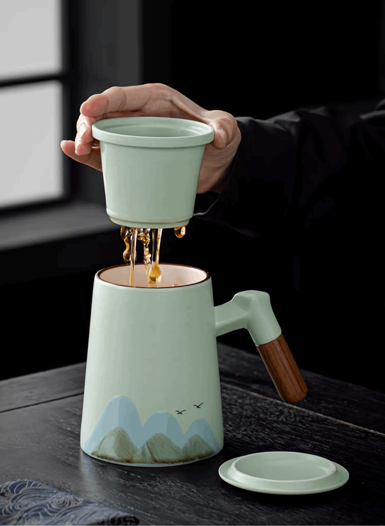 draining tea into teapot