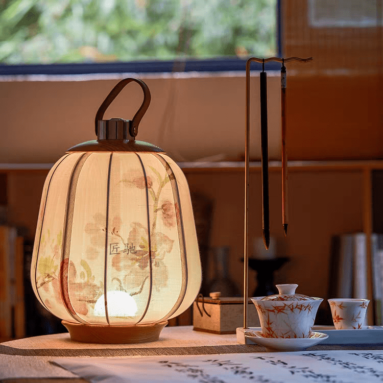 floral lamp lattern lit on table near window