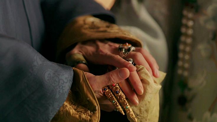 hand on another hand with china traditional jewellery