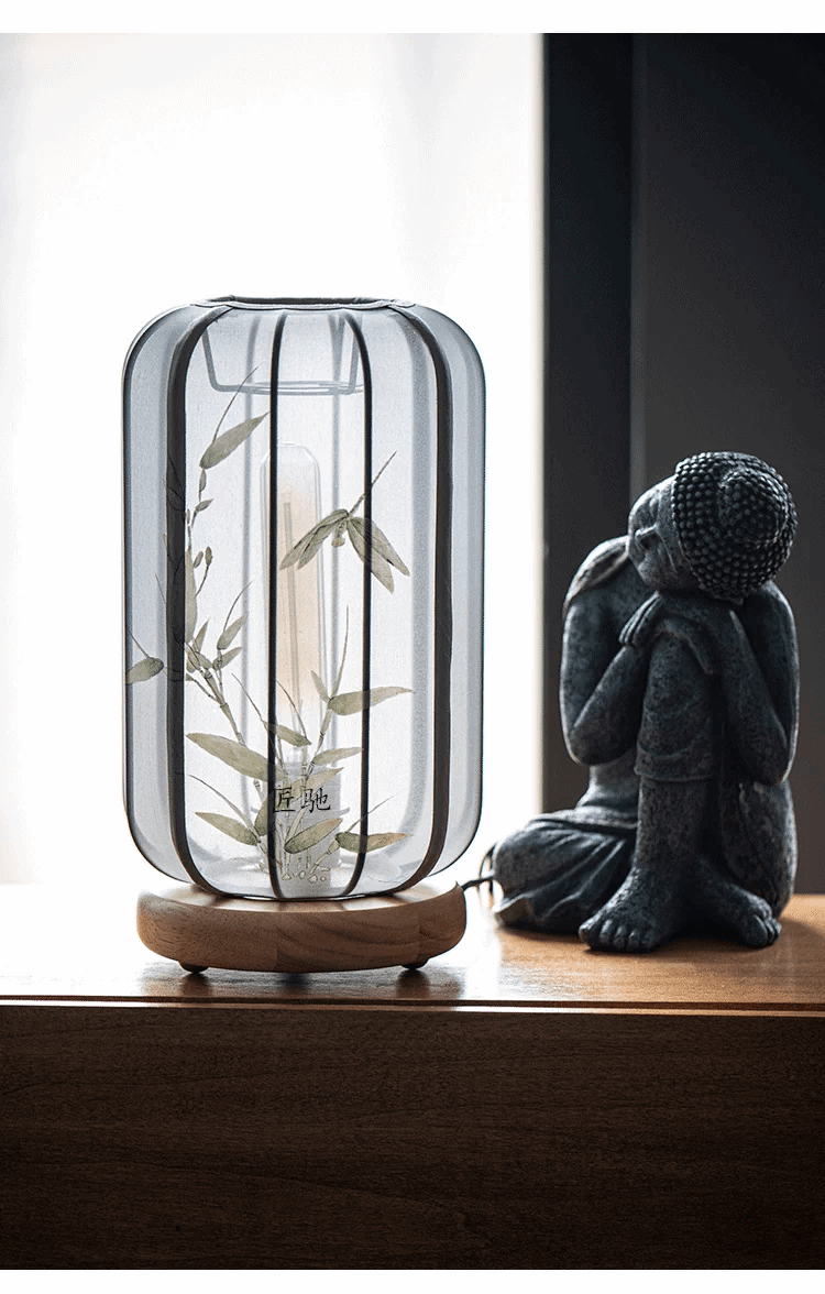 lattern lamp unlit with buddha at the side