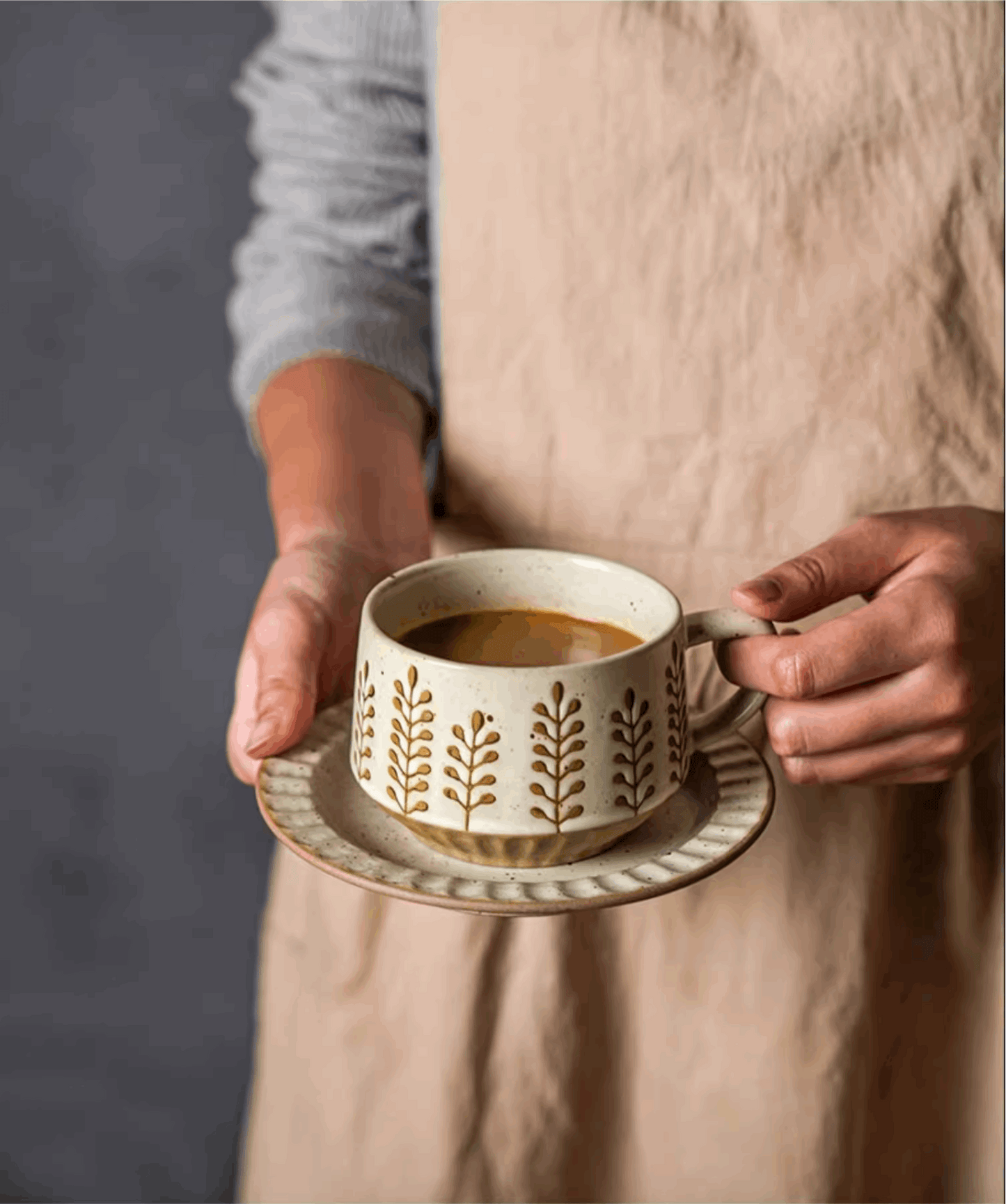 women holding coffee cup