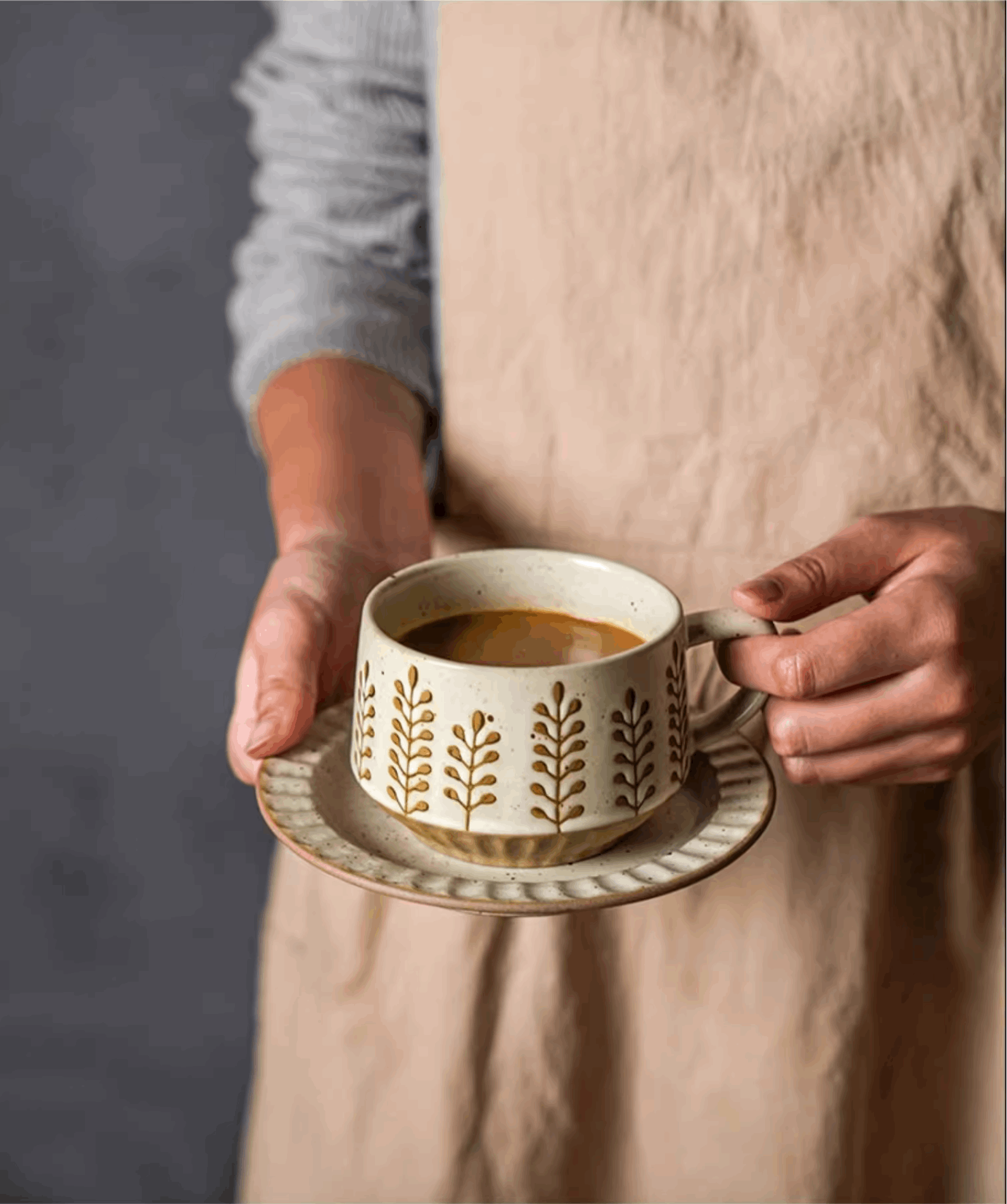women holding coffee cup