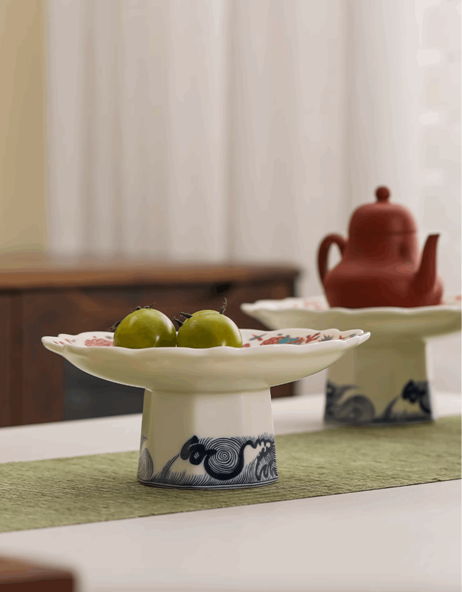 serving platter side view with green grapes on it